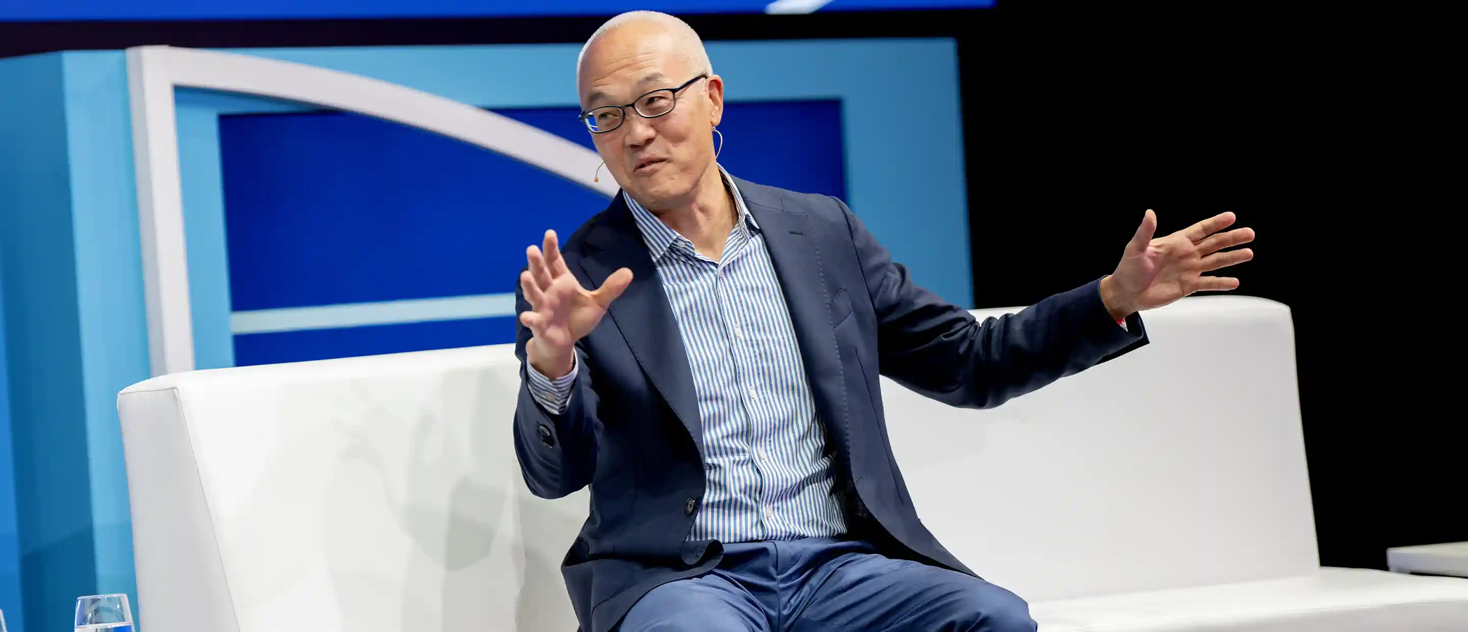Derek Chang on stage at Deutsche Bank Sports Investment Conference