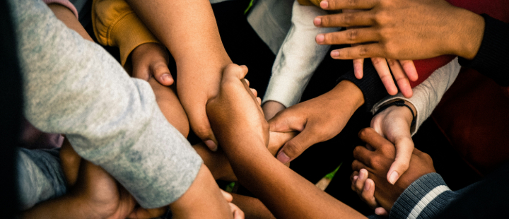 Group of people holding hands