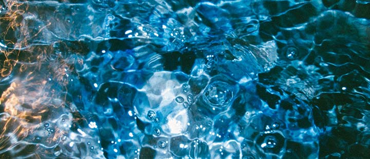 Rippling water surface symbolizing the flow of philanthropic impact